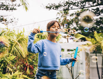Girl Blowing Bubbles