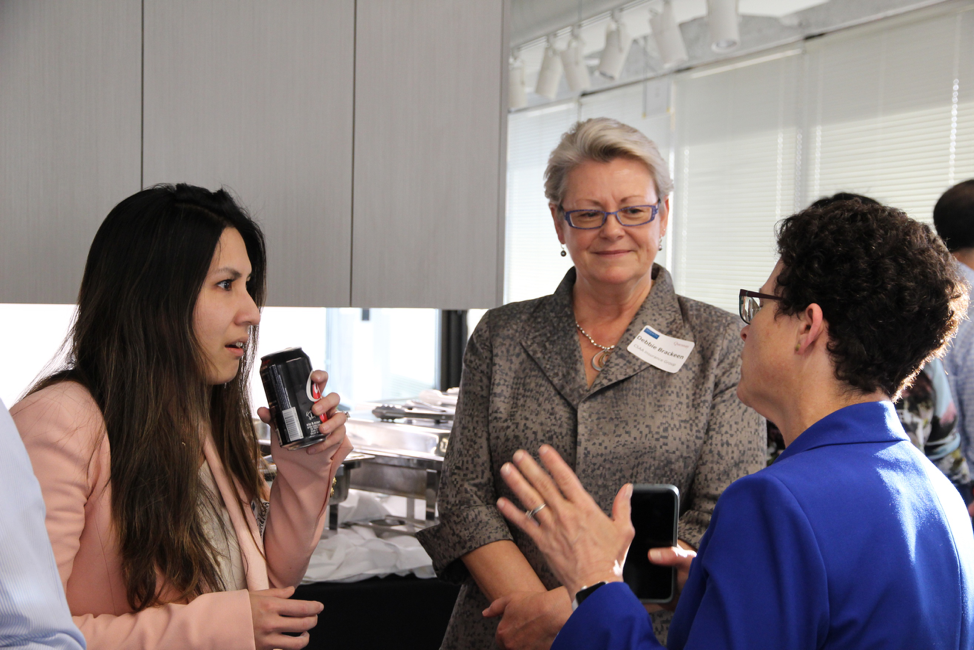 women-conversing-at-meet-and-greet